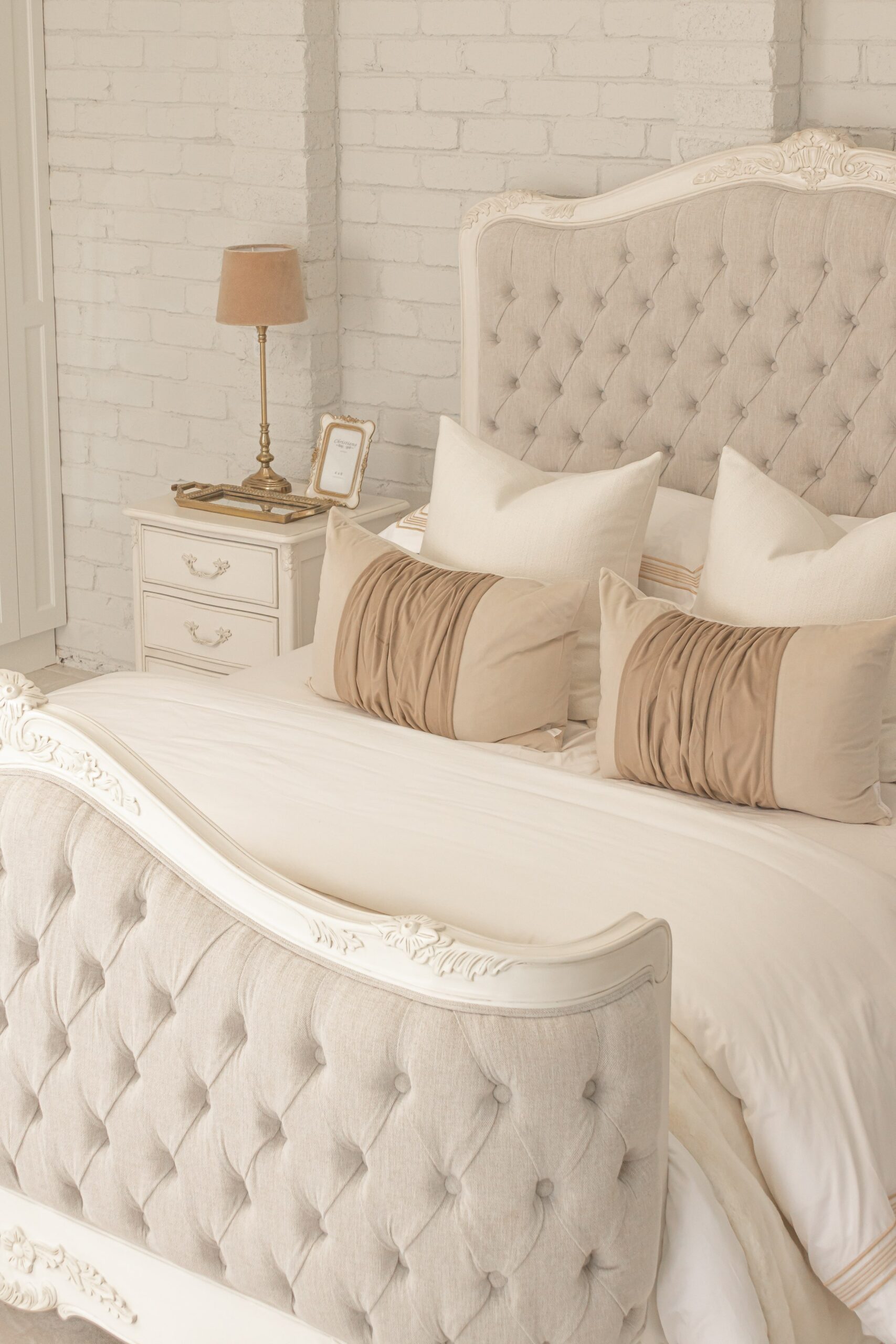 Alice French Provincial Bed in antique white with carved timber detailing and a button-tufted headboard and footboard