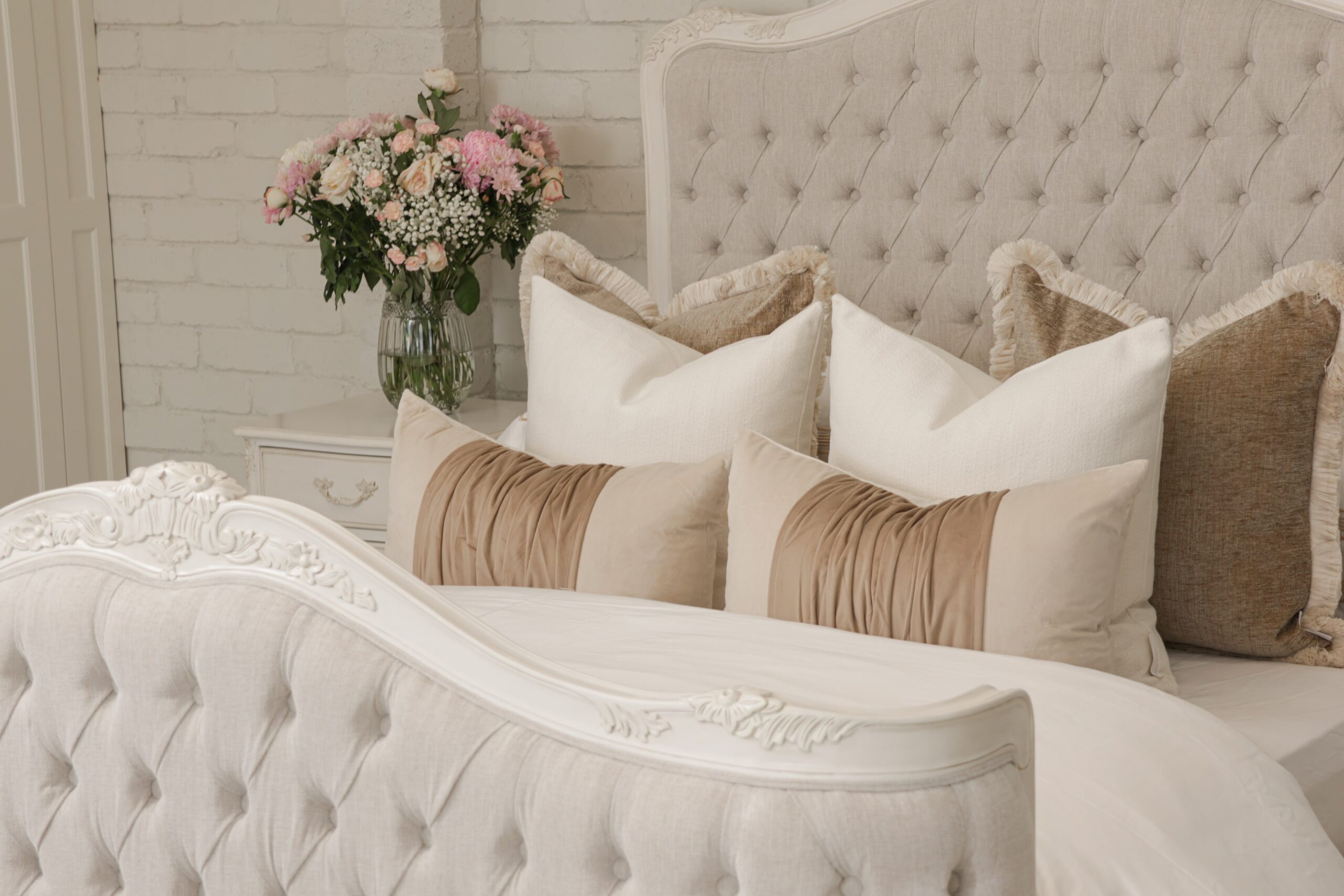 Alice French Provincial Bed in antique white with carved timber detailing and a button-tufted headboard and footboard