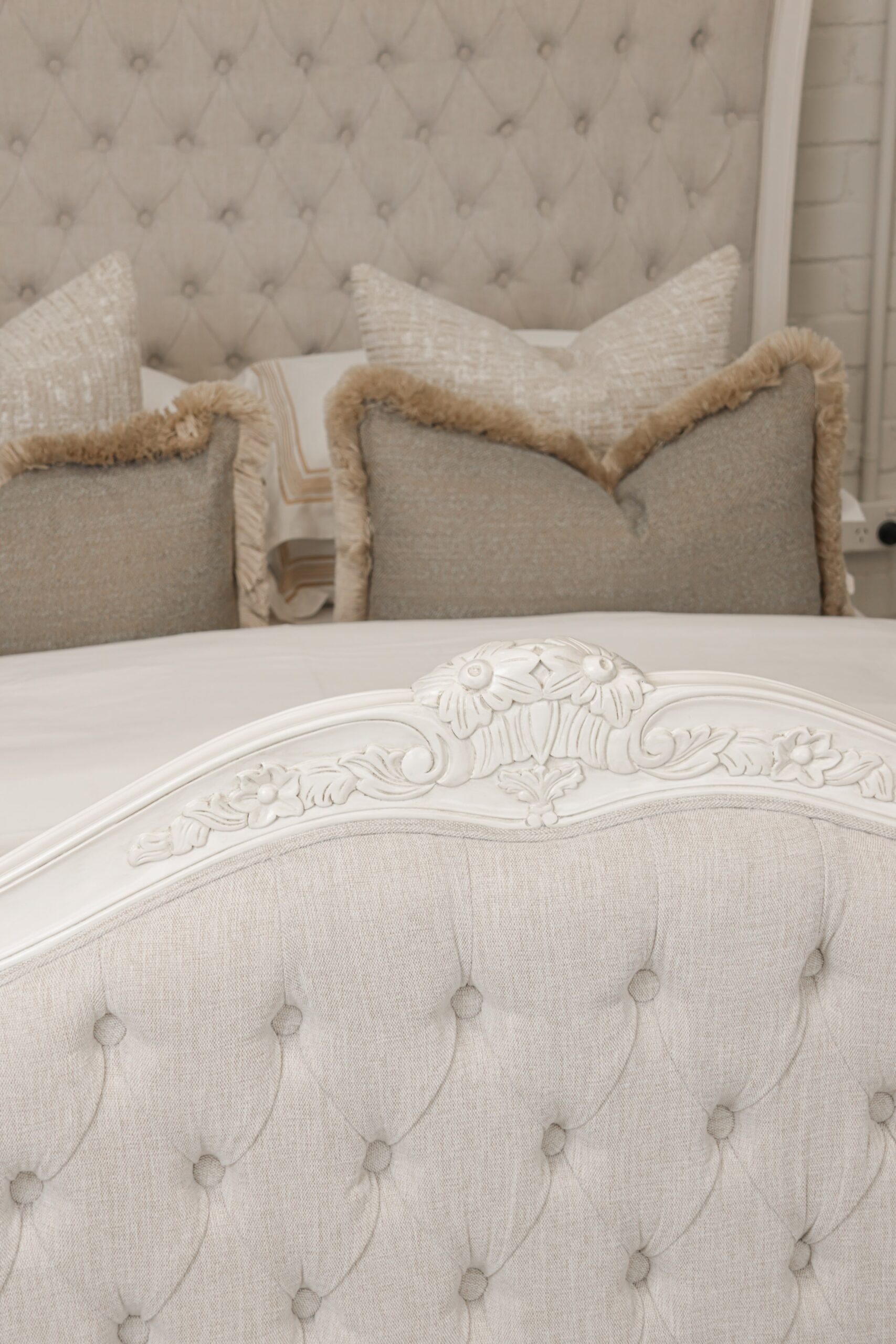 Alice French Provincial Bed in antique white with carved timber detailing and a button-tufted headboard and footboard