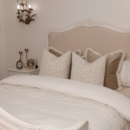 Alice Classic French Bed with an antique white carved frame and smooth upholstered headboard and footboard