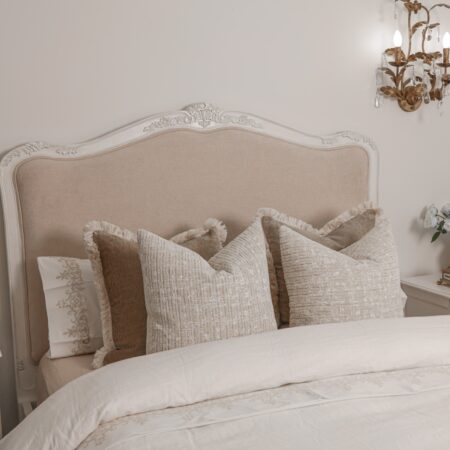 Alice Classic French Bed with an antique white carved frame and smooth upholstered headboard and footboard