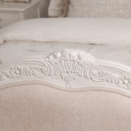 Alice Classic French Bed with an antique white carved frame and smooth upholstered headboard and footboard