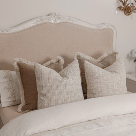 Alice Classic French Bed with an antique white carved frame and smooth upholstered headboard and footboard