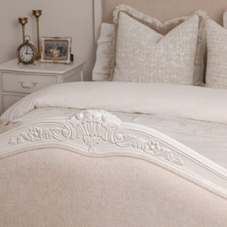 Alice Classic French Bed with an antique white carved frame and smooth upholstered headboard and footboard
