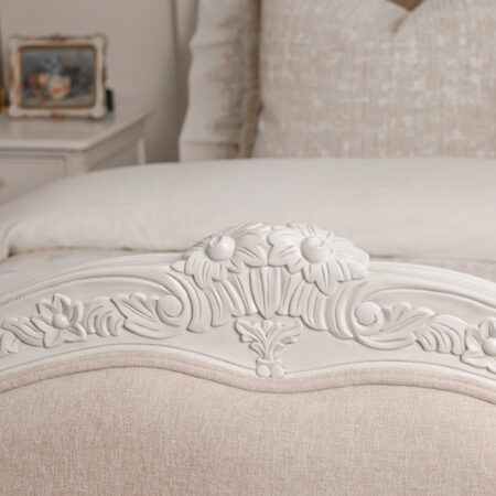 Alice Classic French Bed with an antique white carved frame and smooth upholstered headboard and footboard