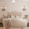 Alice Classic French Bed with an antique white carved frame and smooth upholstered headboard and footboard